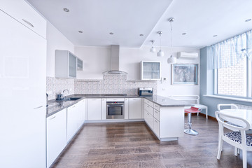 Interior design of a modern white kitchen in a new house.