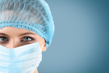 Female surgeon on blue background