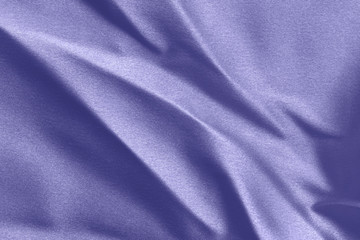 Texture of a crumpled blue cloth with large folds