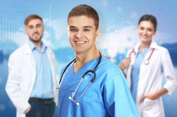 Fototapeta premium Young handsome doctor on white background