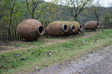 Kvevri, Clay jugs for winemaking near the fence