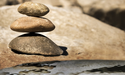 Balancing stones with artificial water reflection