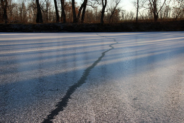 Large crack in the lake first ice in the evening