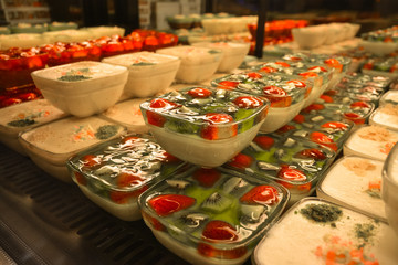 Varied variants of puddings and jelly with strawberry and kiwi berries