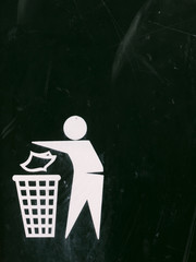 a black and white bin sign with texture scratches and dents and marks and fade, interesting symbol of person putting rubbish into a bin to keep the place clean and safe