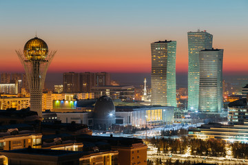 Top view of the Baiterek Monument and the Northern Lights complex on the evening of a winter sunset day in Astana, Kazakhstan