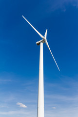 Fototapeta premium Wind turbine with blue sky - renewable energy