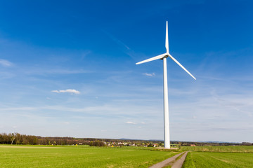 Wind turbine with blue sky - renewable energy