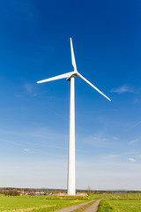 Wind turbine with blue sky - renewable energy