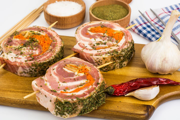 Raw meat rolls on wooden skewers for frying