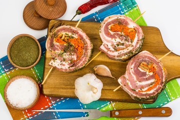 Raw meat rolls on wooden skewers for frying