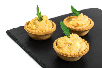 Portion appetizer of tartlets with fish paste