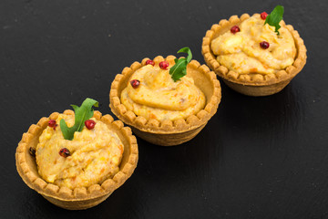 Portion appetizer of tartlets with fish paste