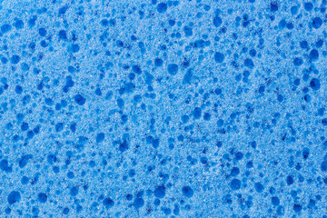Fototapeta na wymiar Blue sponge foam closeup texture.