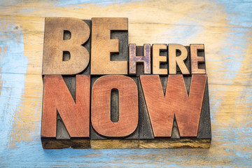 Be here now word abstract in wood type