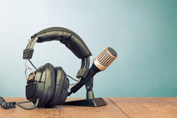 Retro microphone and headphones on table