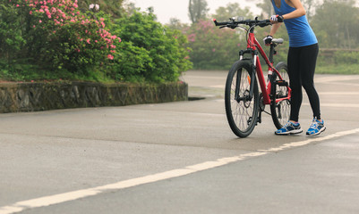 cyclist cycling mountain bike on foggy forest trail