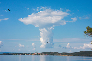 Naklejka na ściany i meble A cloud looks like a mushroom nuclear cloud on Greece coast.