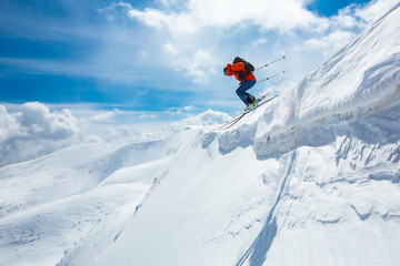 Naklejka na ściany i meble good skiing in the snowy mountains, Carpathians, Ukraine, good winter day, incredible ski jump, ski season