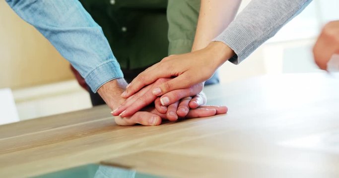 Business colleagues doing hand stack