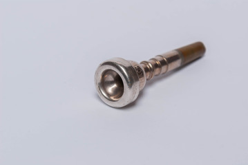 trumpet mouthpiece on white background