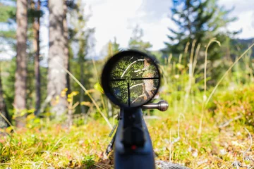 Gordijnen Sniper gun scope view. © mariusltu