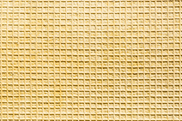 pattern with yellow squares - rear side of a Rubber carpet