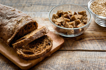 Sliced rye bread on wooden table background