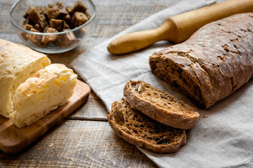 Dried crumbs with bread on kitchen table background