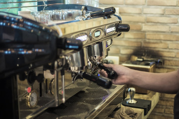A Man Making coffee in the coffee machine