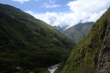 Fototapeta na wymiar Landscape view of a deep valley and gushing river in the remote Peruvian Andes 