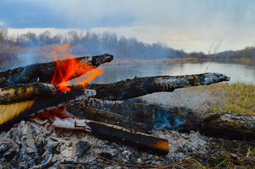 Bonfire in the background water