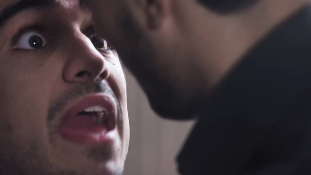 Close up on Passionate kiss between gay men, after a discussion