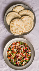 Tabbouleh salad against white background. Selective focus.