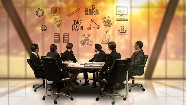 Businesspeople looking at futuristic screen showing big data symbol
