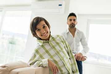 Obraz premium Happy Arabic Muslim family at modern home having fun and good time together