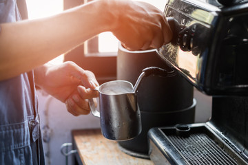 barista use machine making coffee