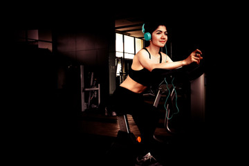 Fototapeta na wymiar Woman exercise in gym.