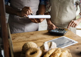 Men Checking Stock of Pastry in Bakery Shop
