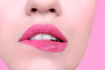 Fototapeta premium Face of beautiful young woman on color background, closeup