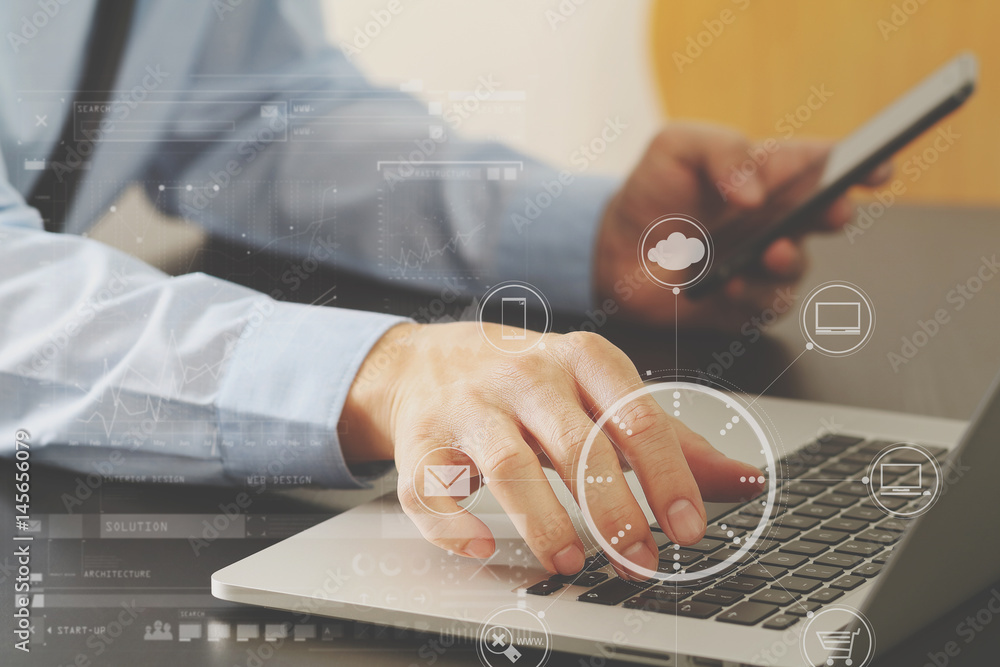 Poster close up of businessman working with mobile phone and laptop computer on wooden desk in modern offic