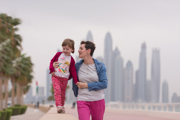 mother and cute little girl on the promenade