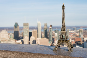 Eiffel tower miniature and Montreal skyline in the background