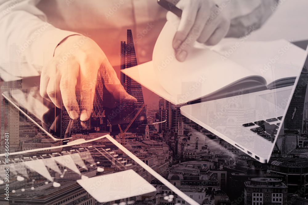 Poster close up of businessman working with smart phone and digital tablet and laptop computer on wooden de