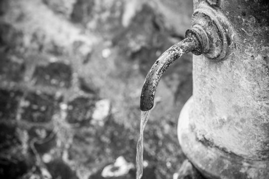 Old fountain in Rome, Italy (black and white picture)