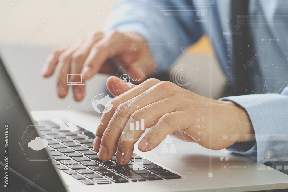 Poster close up of businessman typing keyboard with laptop computer on wooden desk in modern office with vi