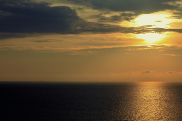 Fototapeta na wymiar Golden water sea background on sunset over sea