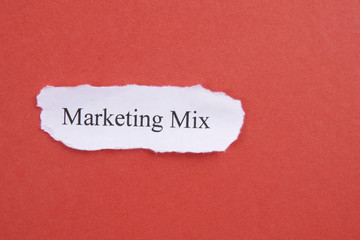 Marketing conceptual word on torn paper.