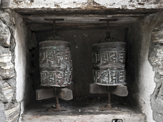 Vintage buddhist prayer wheels in Nepal