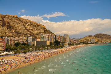Beautiful panoramic view of  Alicante Postiguet beach and castle Santa Barbara in Spain Valencian Community